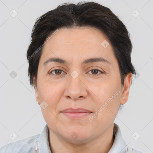 Joyful white adult female with short  brown hair and brown eyes