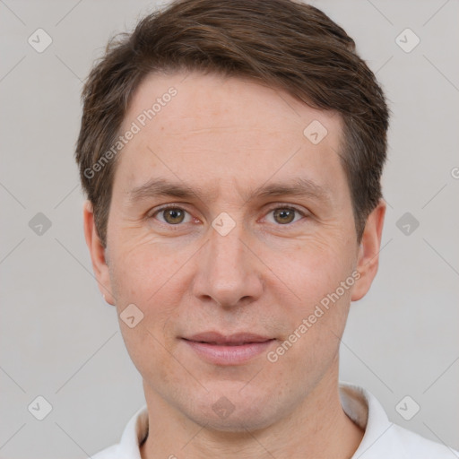 Joyful white adult male with short  brown hair and grey eyes