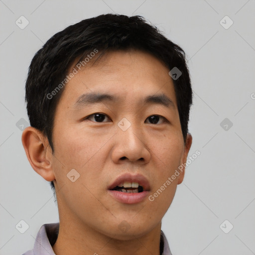 Neutral asian young-adult male with short  brown hair and brown eyes