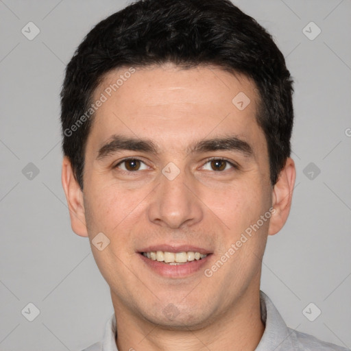 Joyful white young-adult male with short  black hair and brown eyes