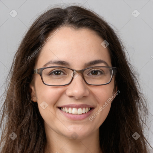 Joyful white young-adult female with long  brown hair and brown eyes