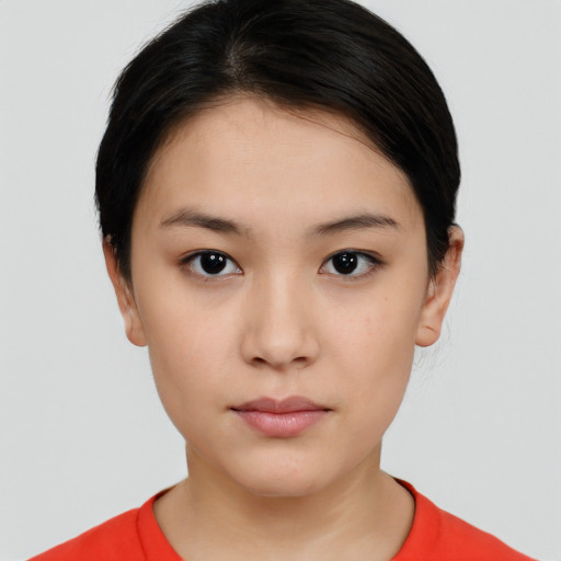 Neutral white young-adult female with short  black hair and brown eyes