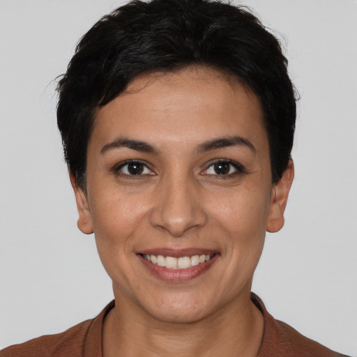 Joyful white young-adult female with short  black hair and brown eyes