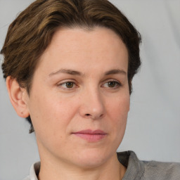 Joyful white adult female with short  brown hair and brown eyes