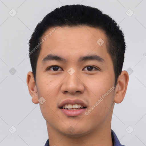 Joyful latino young-adult male with short  black hair and brown eyes