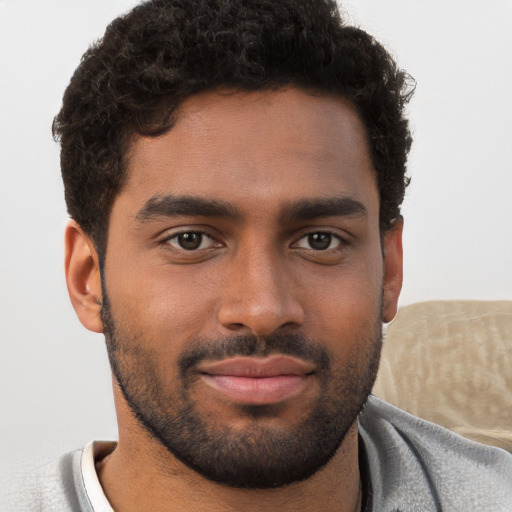 Neutral black young-adult male with short  brown hair and brown eyes