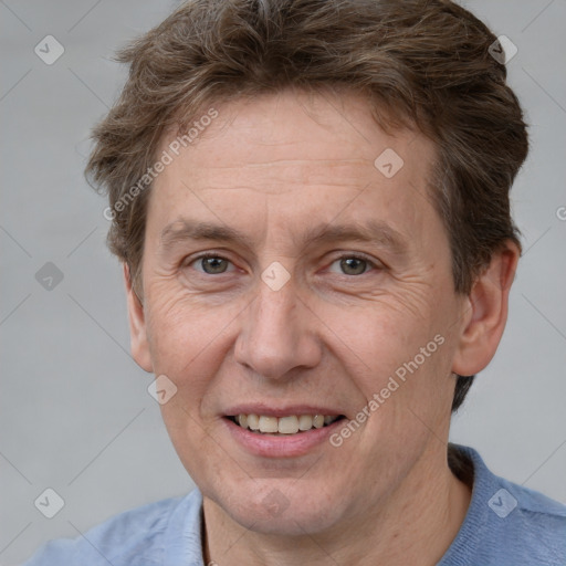 Joyful white adult male with short  brown hair and grey eyes