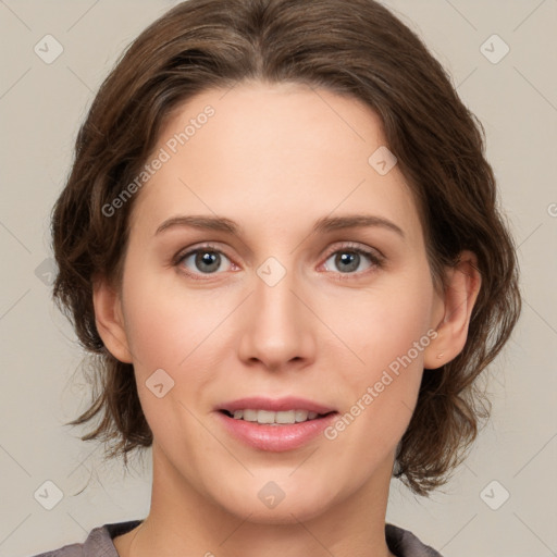 Joyful white young-adult female with medium  brown hair and green eyes