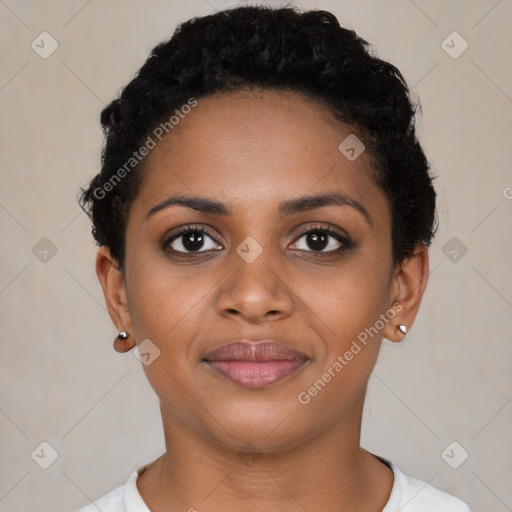 Joyful black young-adult female with short  black hair and brown eyes