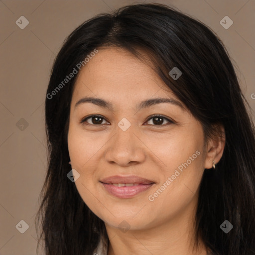 Joyful asian young-adult female with long  brown hair and brown eyes