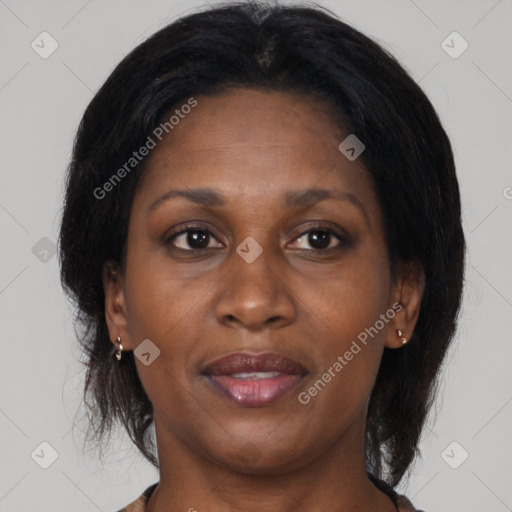 Joyful black adult female with medium  black hair and brown eyes