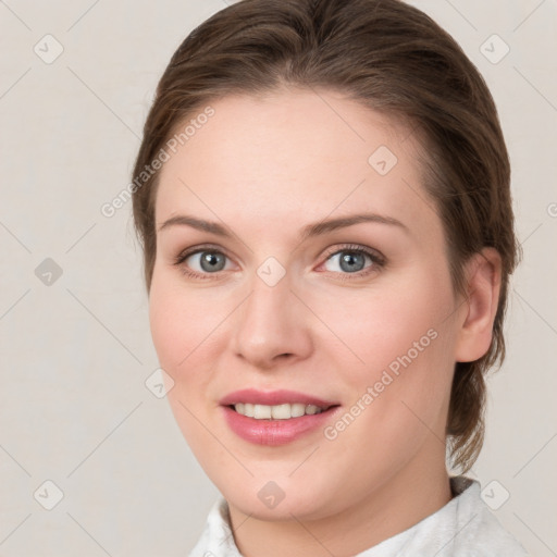 Joyful white young-adult female with medium  brown hair and green eyes