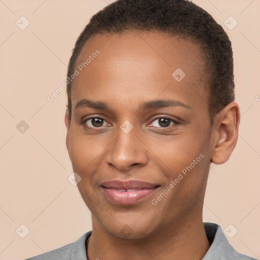 Joyful black young-adult male with short  brown hair and brown eyes