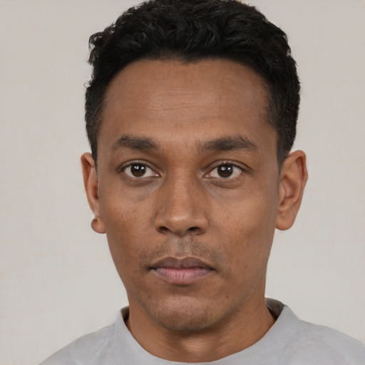 Neutral black young-adult male with short  black hair and brown eyes