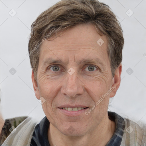 Joyful white middle-aged male with short  brown hair and brown eyes