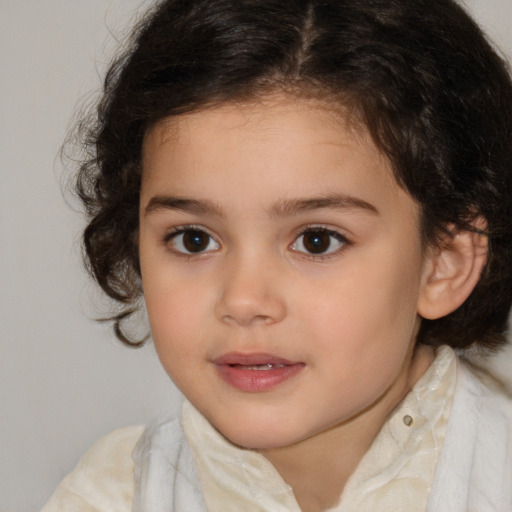 Joyful white child female with medium  brown hair and brown eyes