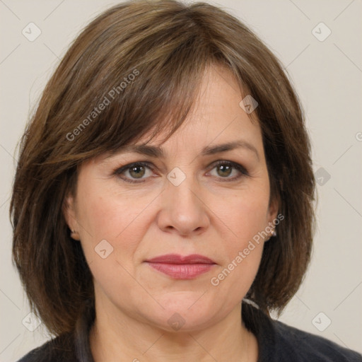 Joyful white adult female with medium  brown hair and grey eyes