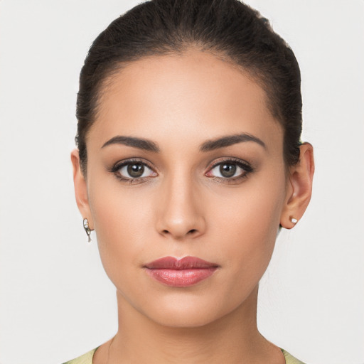 Neutral latino young-adult female with short  brown hair and brown eyes