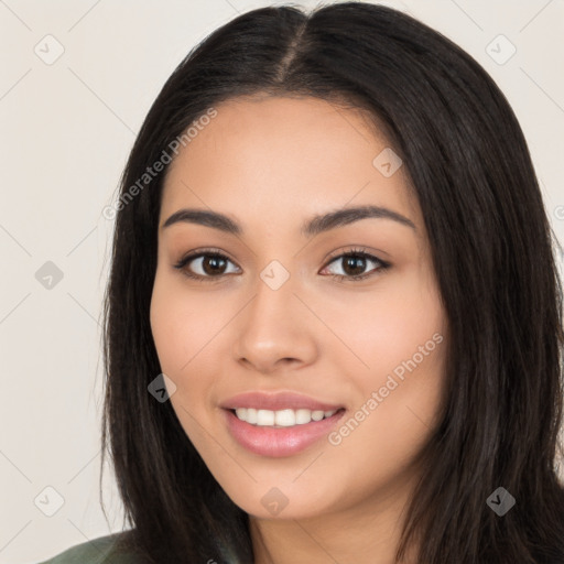 Joyful latino young-adult female with long  black hair and brown eyes