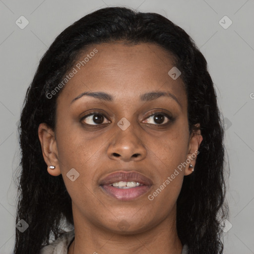 Joyful black young-adult female with long  brown hair and brown eyes