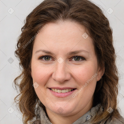 Joyful white adult female with long  brown hair and brown eyes