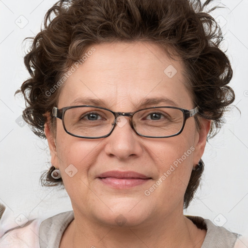 Joyful white adult female with medium  brown hair and blue eyes