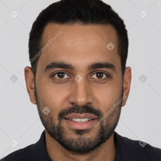 Joyful latino young-adult male with short  black hair and brown eyes