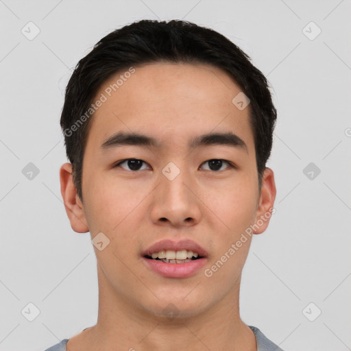 Joyful asian young-adult male with short  black hair and brown eyes