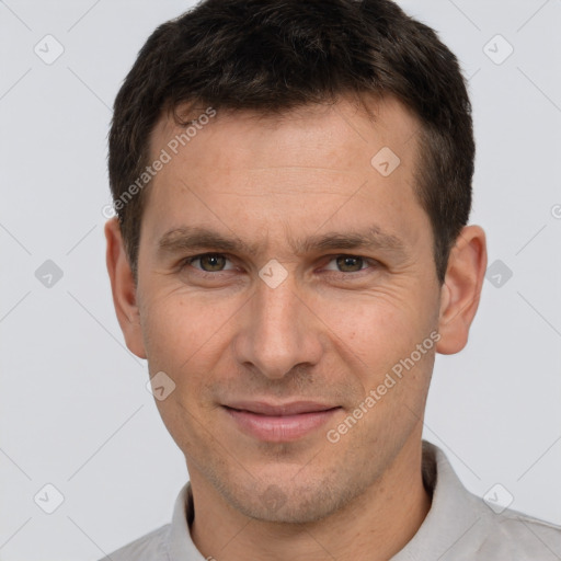 Joyful white adult male with short  brown hair and brown eyes