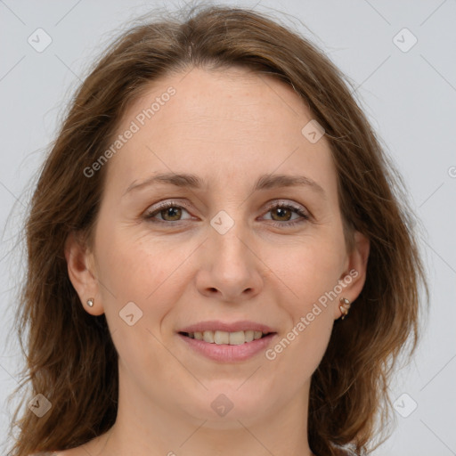 Joyful white adult female with medium  brown hair and brown eyes