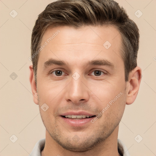 Joyful white young-adult male with short  brown hair and brown eyes