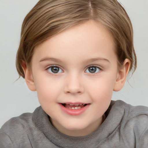 Joyful white child female with medium  brown hair and grey eyes