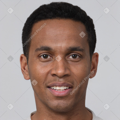 Joyful black young-adult male with short  brown hair and brown eyes