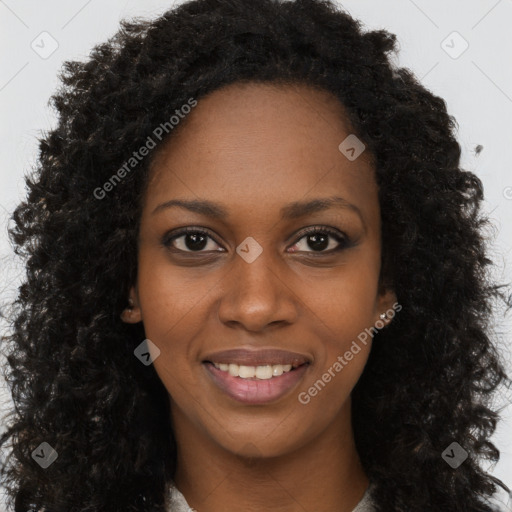 Joyful black young-adult female with long  brown hair and brown eyes