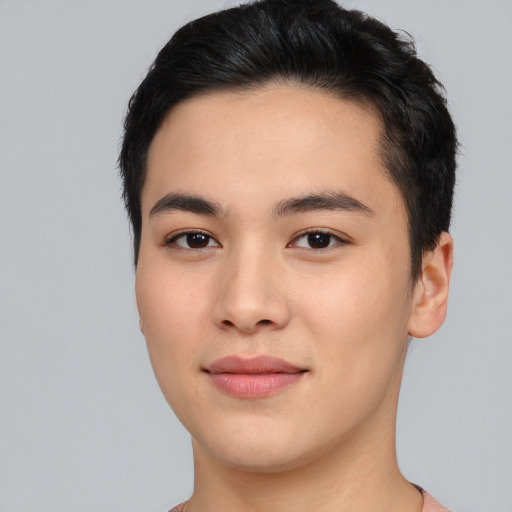 Joyful asian young-adult male with short  black hair and brown eyes