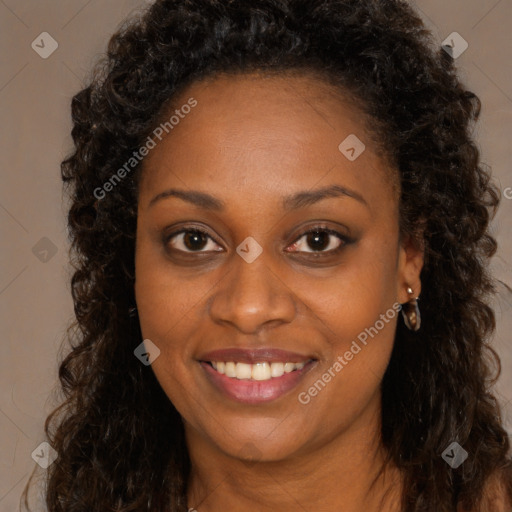 Joyful black young-adult female with long  brown hair and brown eyes