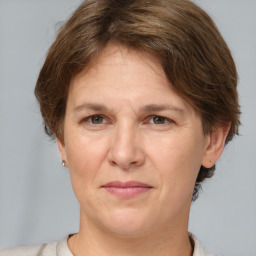 Joyful white adult female with short  brown hair and brown eyes