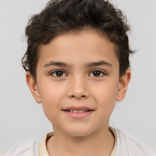 Joyful white child male with short  brown hair and brown eyes