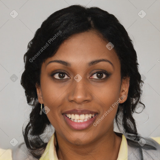 Joyful black young-adult female with long  black hair and brown eyes