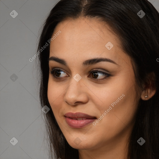 Joyful latino young-adult female with long  brown hair and brown eyes