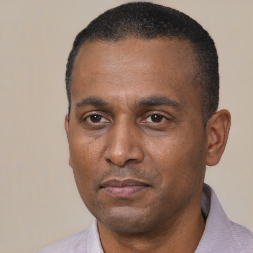 Neutral black adult male with short  black hair and brown eyes