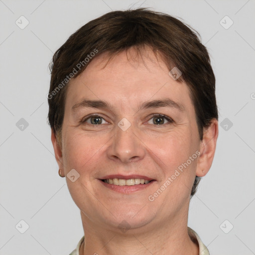 Joyful white adult female with short  brown hair and grey eyes