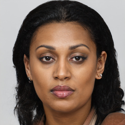 Neutral latino young-adult female with long  black hair and brown eyes