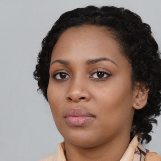 Neutral black young-adult female with medium  black hair and brown eyes