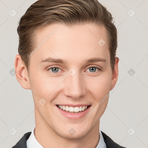 Joyful white young-adult male with short  brown hair and grey eyes