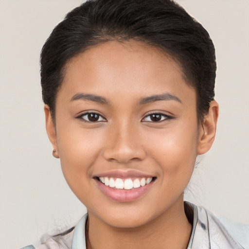 Joyful white young-adult female with short  brown hair and brown eyes