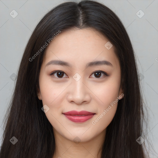 Joyful asian young-adult female with long  brown hair and brown eyes