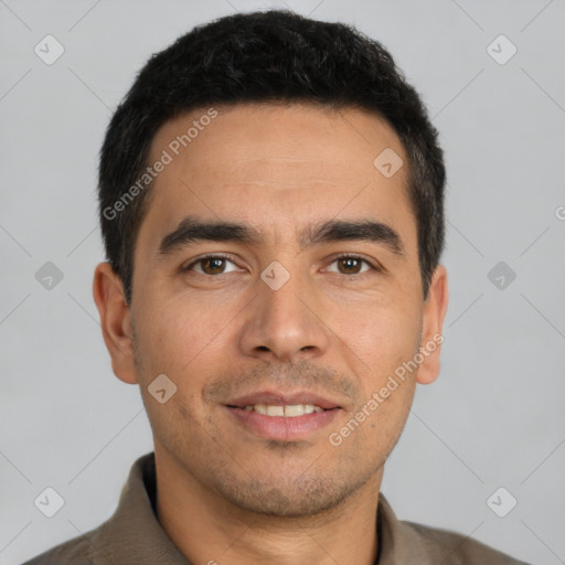 Joyful white young-adult male with short  black hair and brown eyes