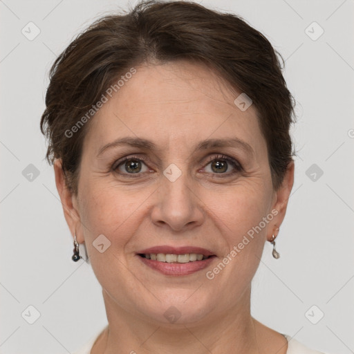 Joyful white adult female with short  brown hair and grey eyes