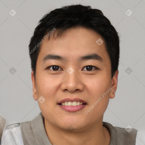 Joyful asian young-adult male with short  black hair and brown eyes